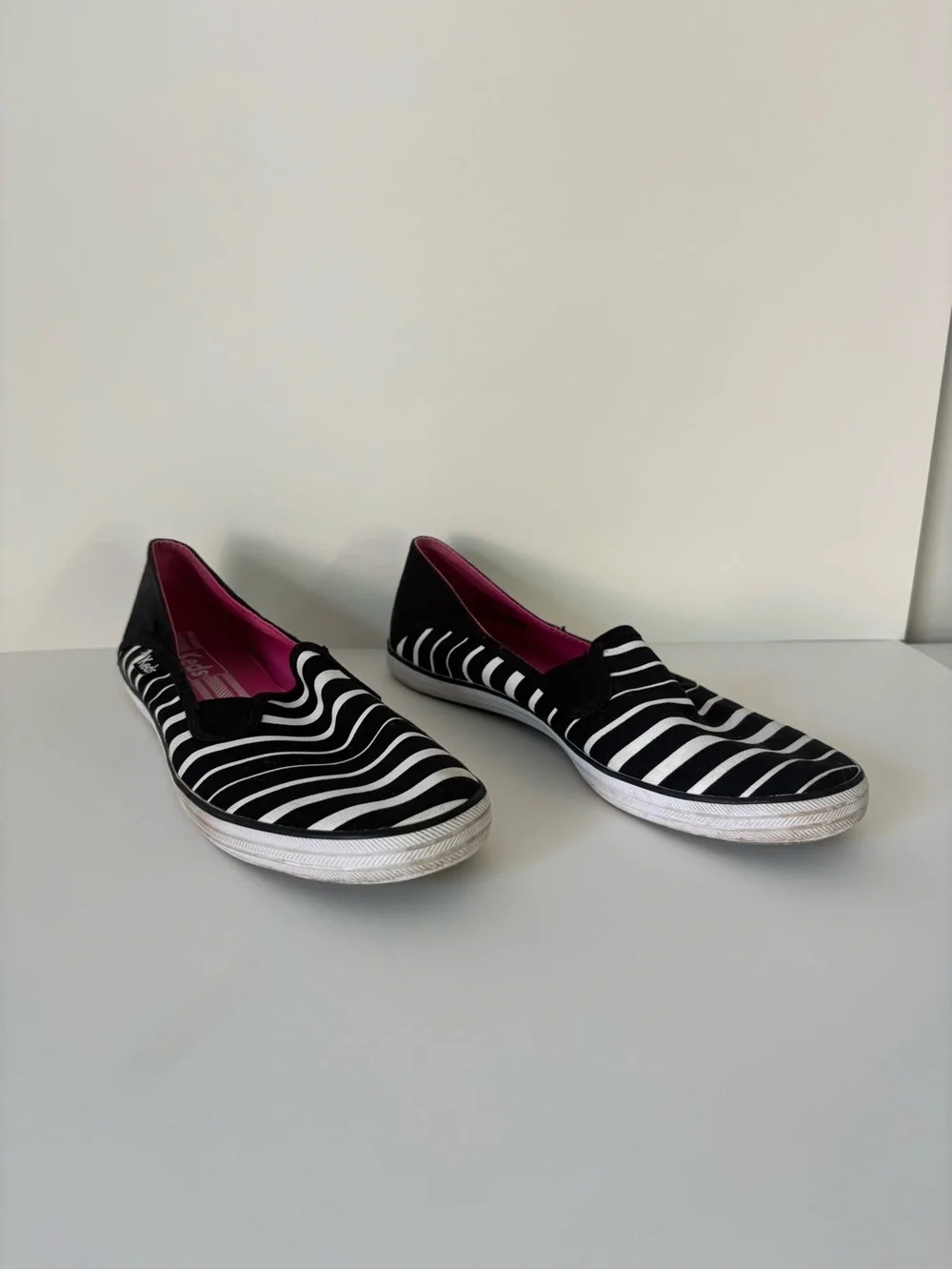 Keds Women’s Black & White Striped Slip-On Sneakers with Pink Insole